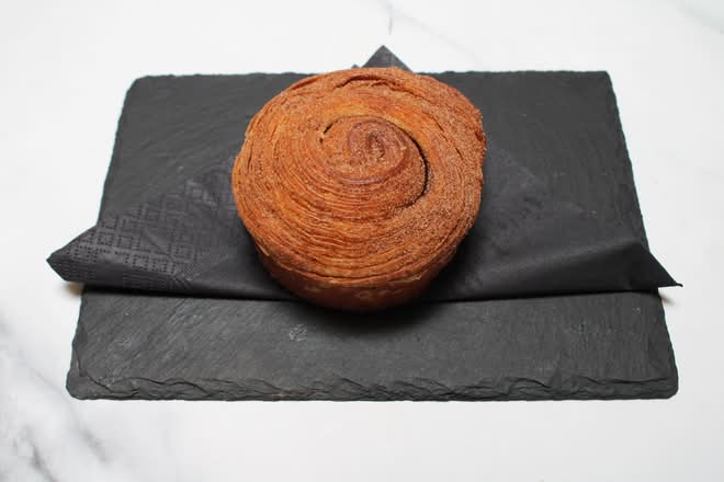 Cinnamon bun on a slate board
